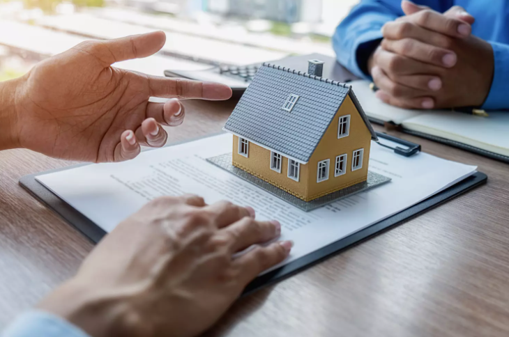Verifying a cash buyer before you sell my house fast with house model on documents